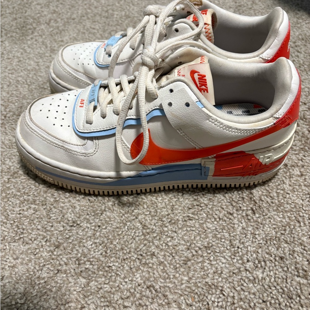 Nike Kids White and Orange Sneakers with Blue Accents